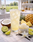 orbet Sunrise loaded tea featuring tropical piña colada, bright lime sorbet, and smooth vanilla flavors. This zero-sugar loaded tea contains 60mg caffeine and makes up to 32oz for refreshing, low-caffeine energy. Pale yellow iced tea served in a clear glass with a sunny tropical-inspired presentation.