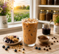 Blueberry Cobbler Café Coffee Potion featuring smooth low-acid coffee with sweet blueberry flavor, buttery cobbler notes, creamy texture, 10g protein, and 60 mg caffeine served over ice.