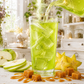 Hex Brew green apple loaded tea pouring over ice with caramel apple styling